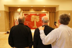 “Big Red” is on loan for four years from the State Historical Society of Iowa, which received the flag in 1919 from an Iowa Civil War veteran. The flag, shown here on its March 5 arrival on campus, is housed at the Holliday Alumni Center where a museum-quality showcase has been built for the 10- by 7-foot framed flag.